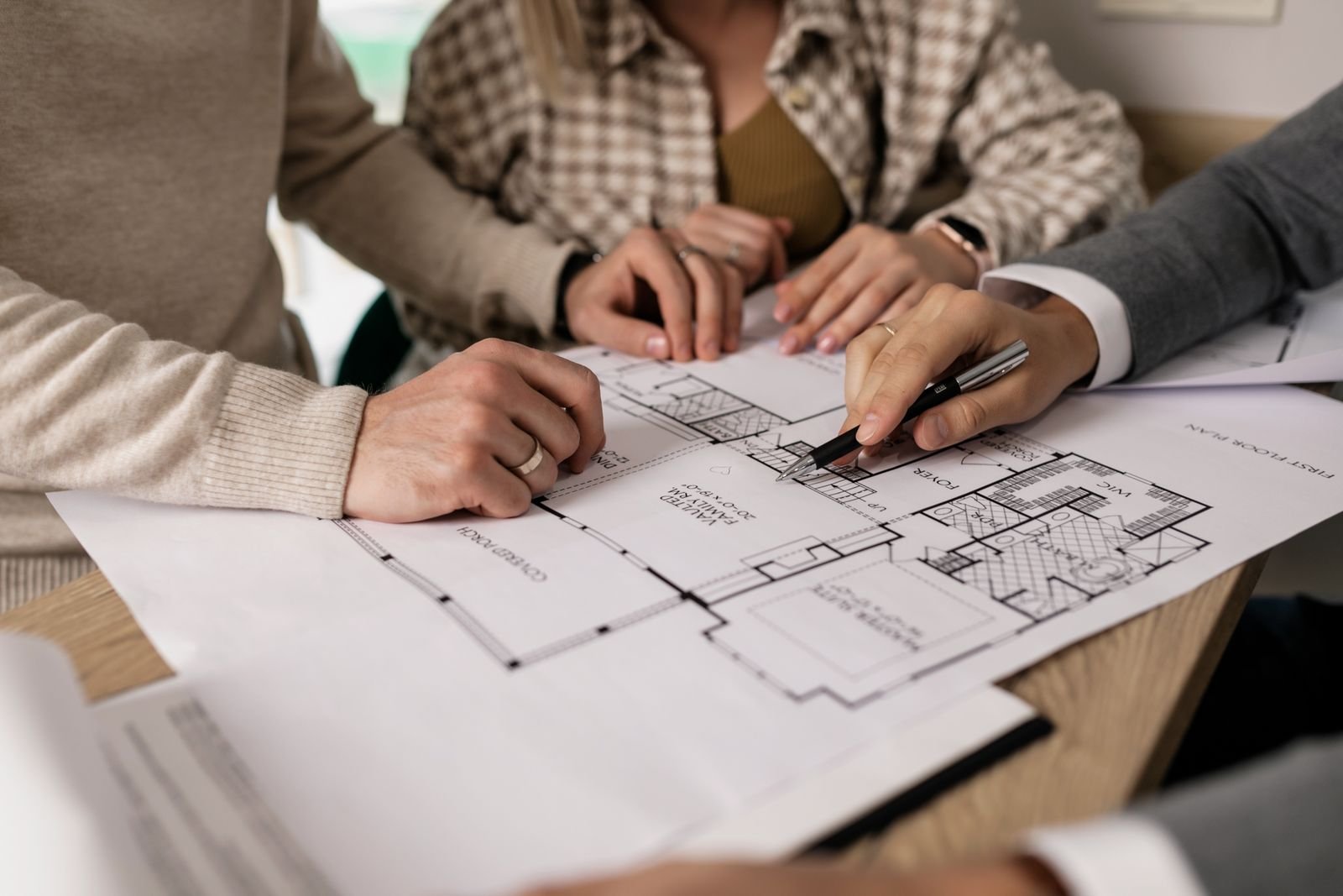 Architect discussing house plans with clients