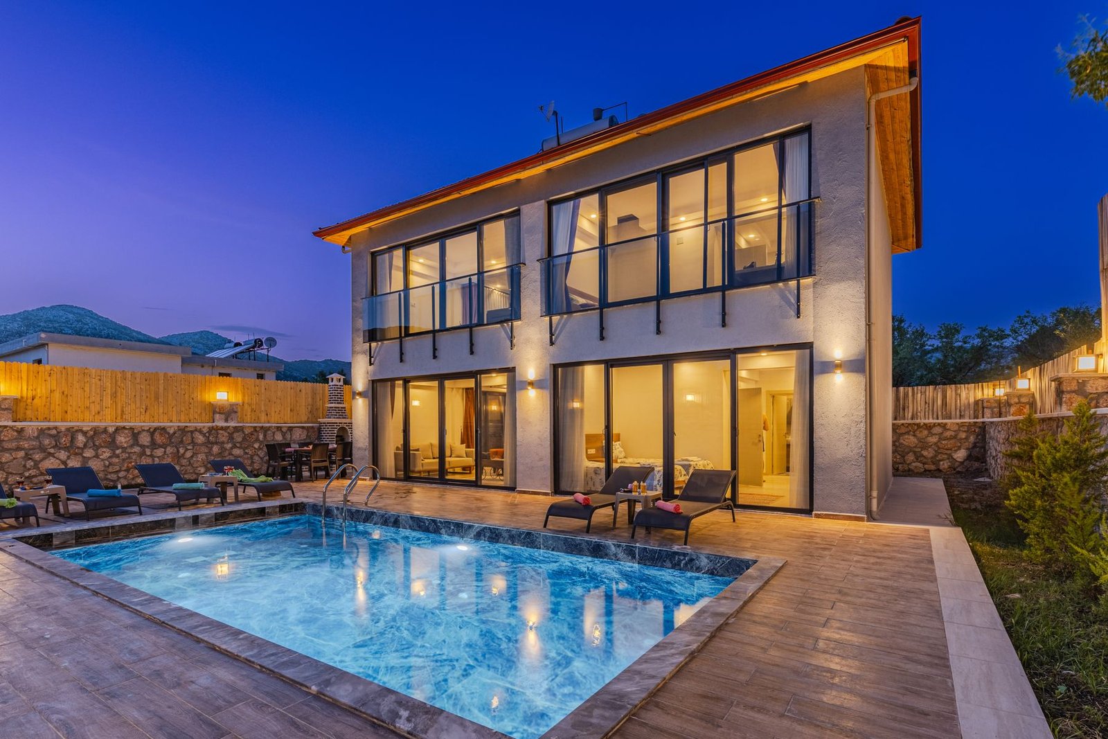 Modern luxury house with pool seen through a window