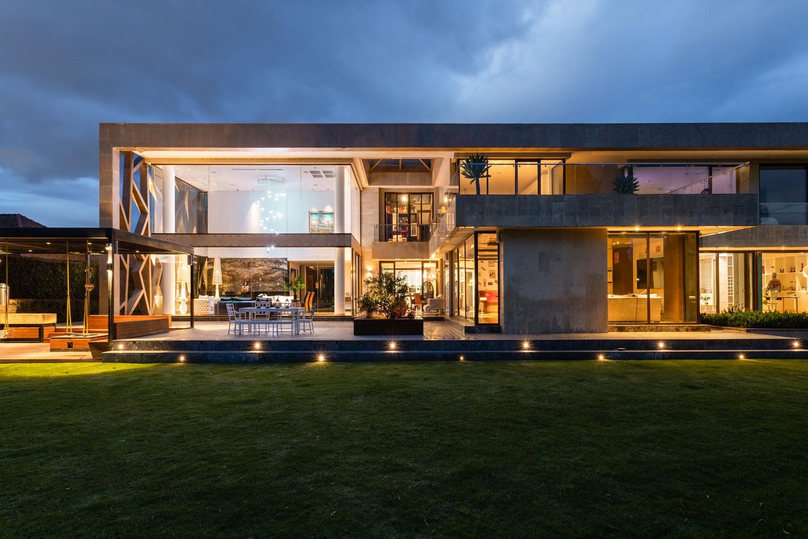 Contemporary villa facade lit at dusk