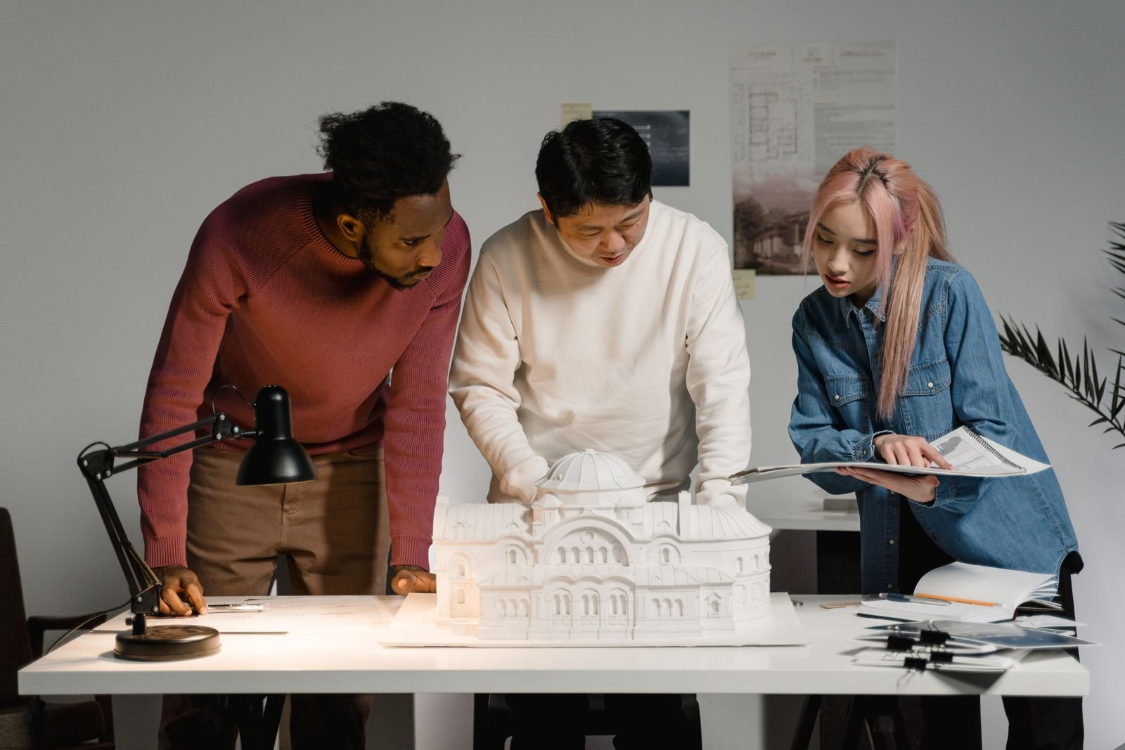 Architects reviewing a scale model together